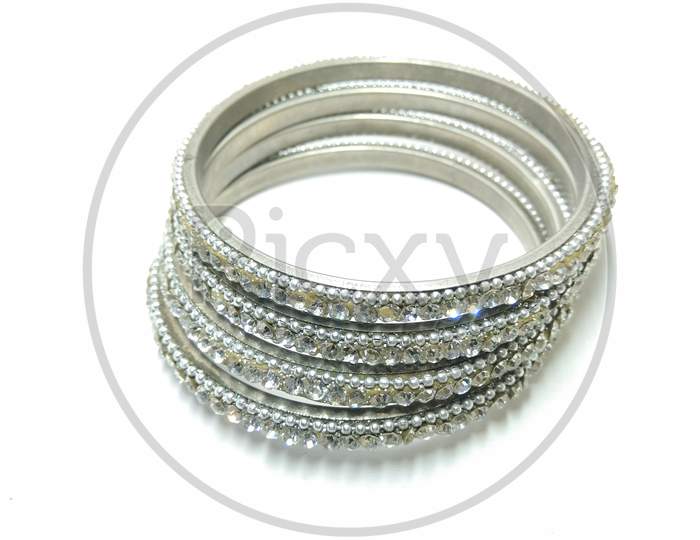 Silver Bangles Over an Isolated White Background