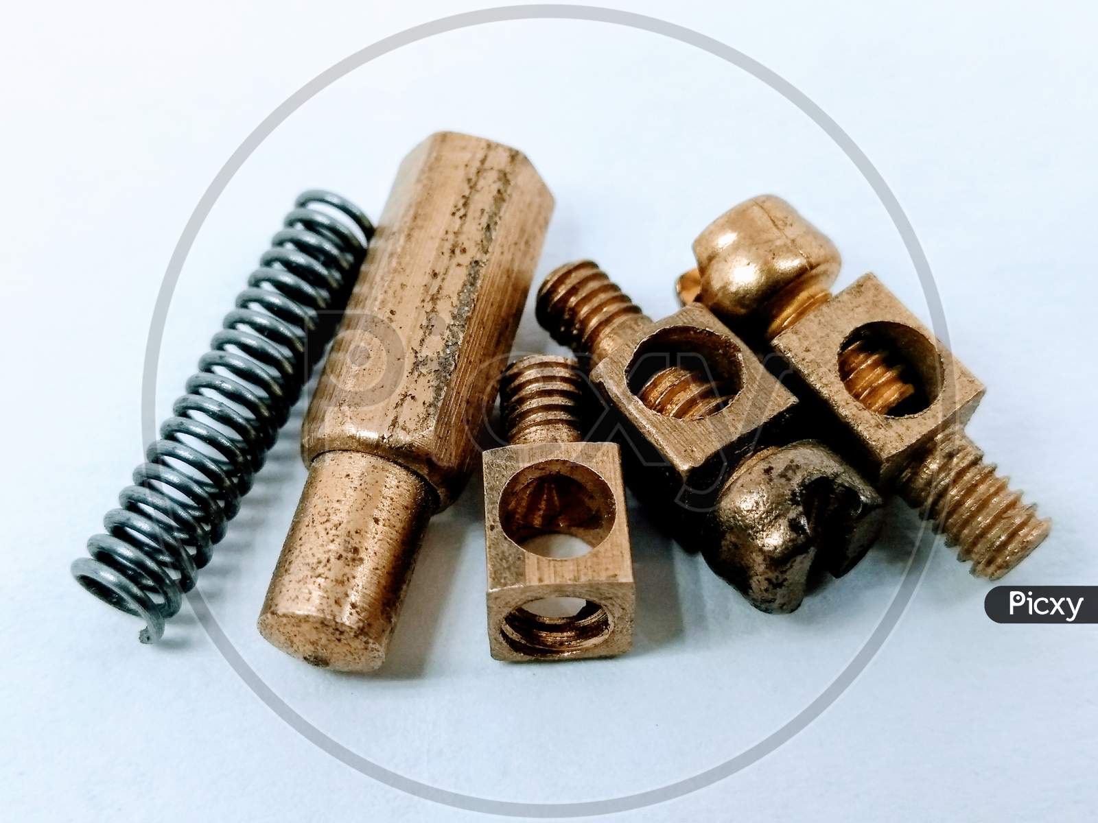 Brass Nuts Or Screws Over an isolated White Background