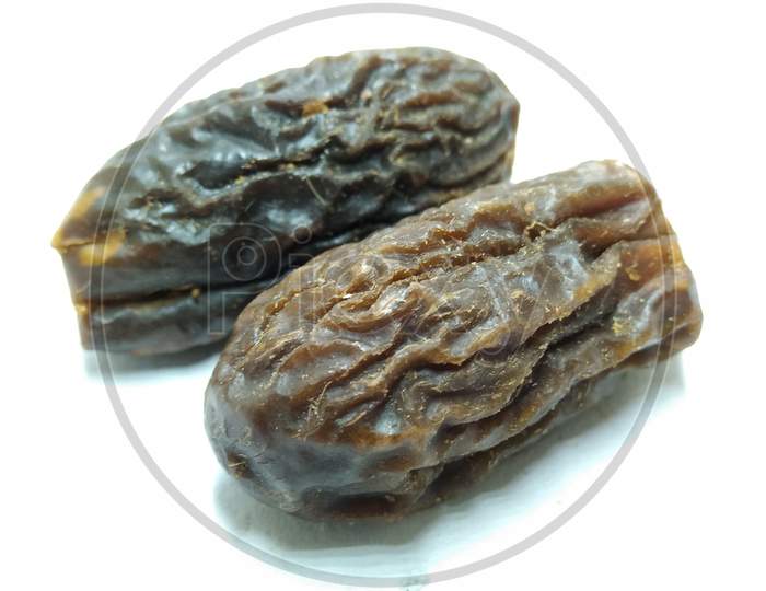 Dried Dates On an White Background