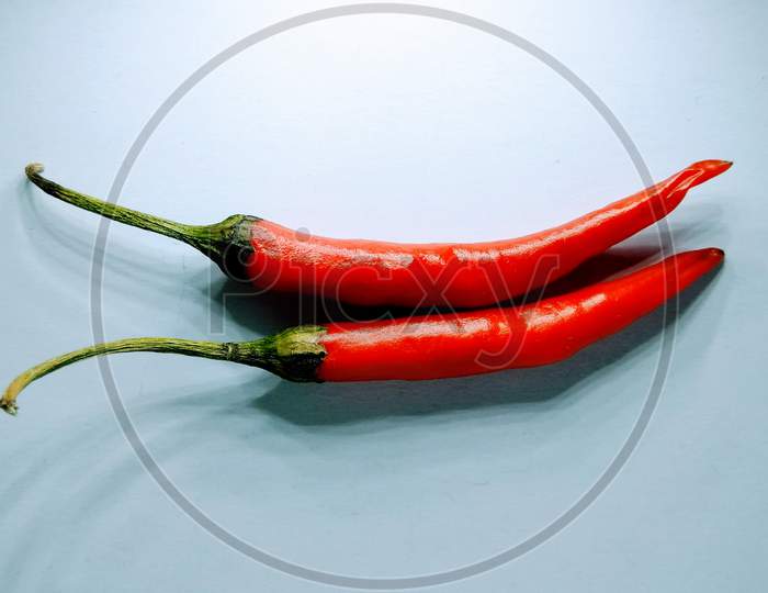 Red Chilies On White Background