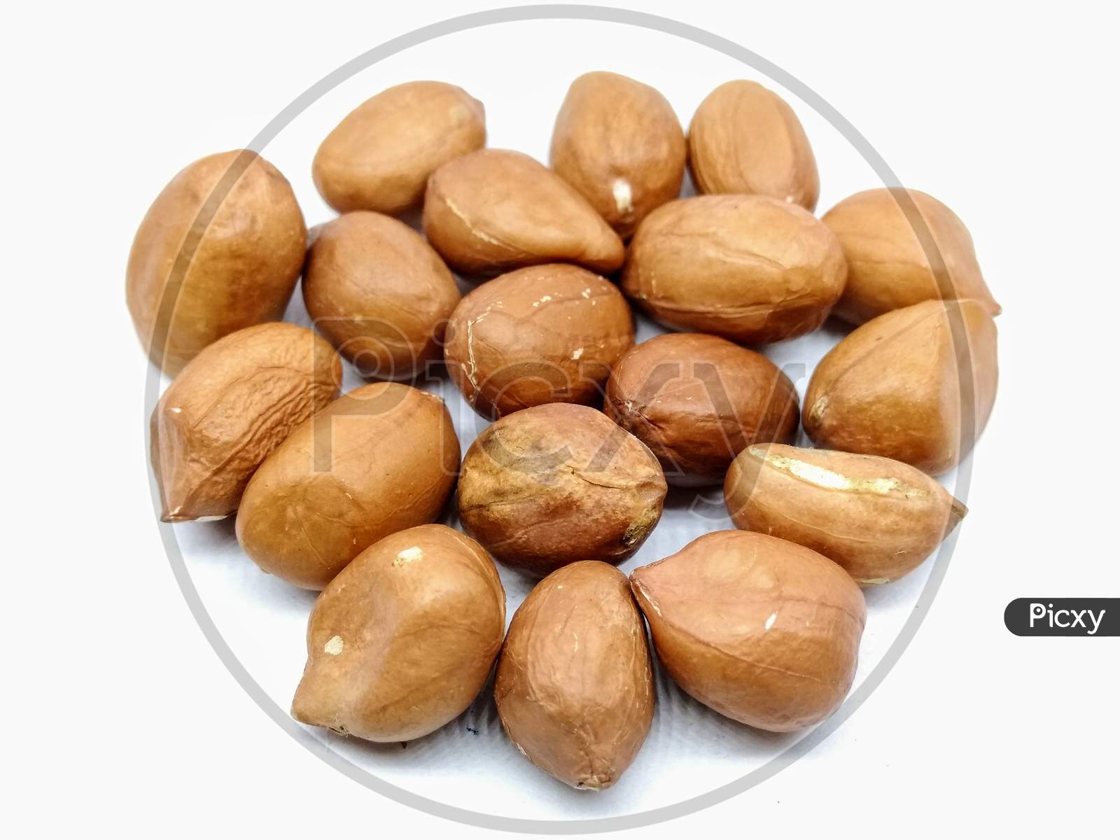 Ground Nuts or Peanuts Closeup On White Background