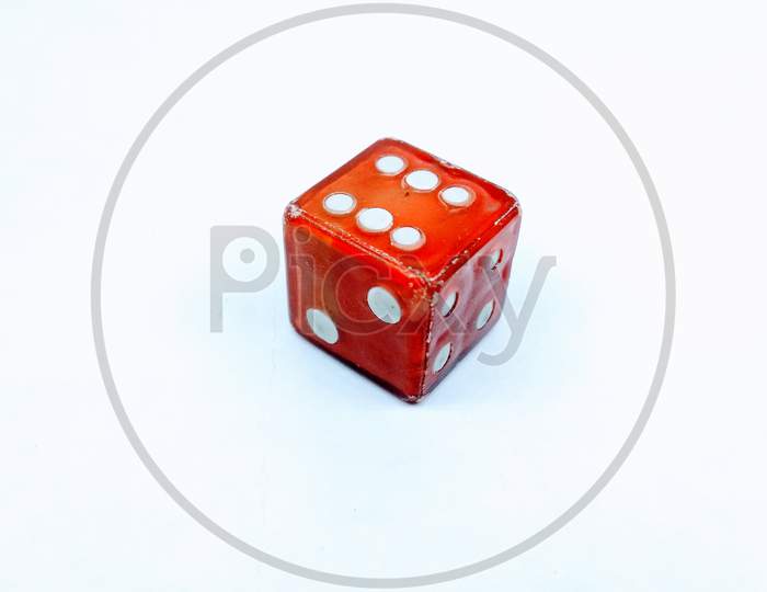 Dice and Coins On an Isolated White Background