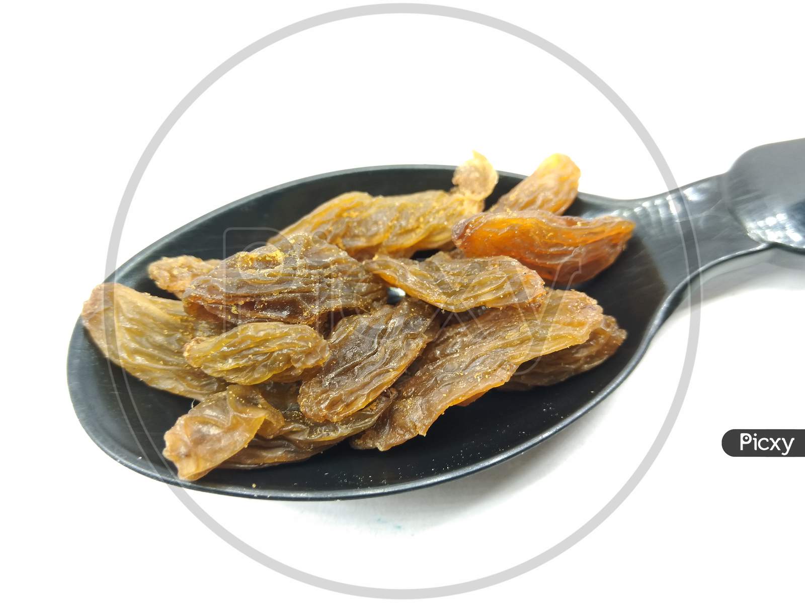 Dried Grapes Or Raisin On an White Background