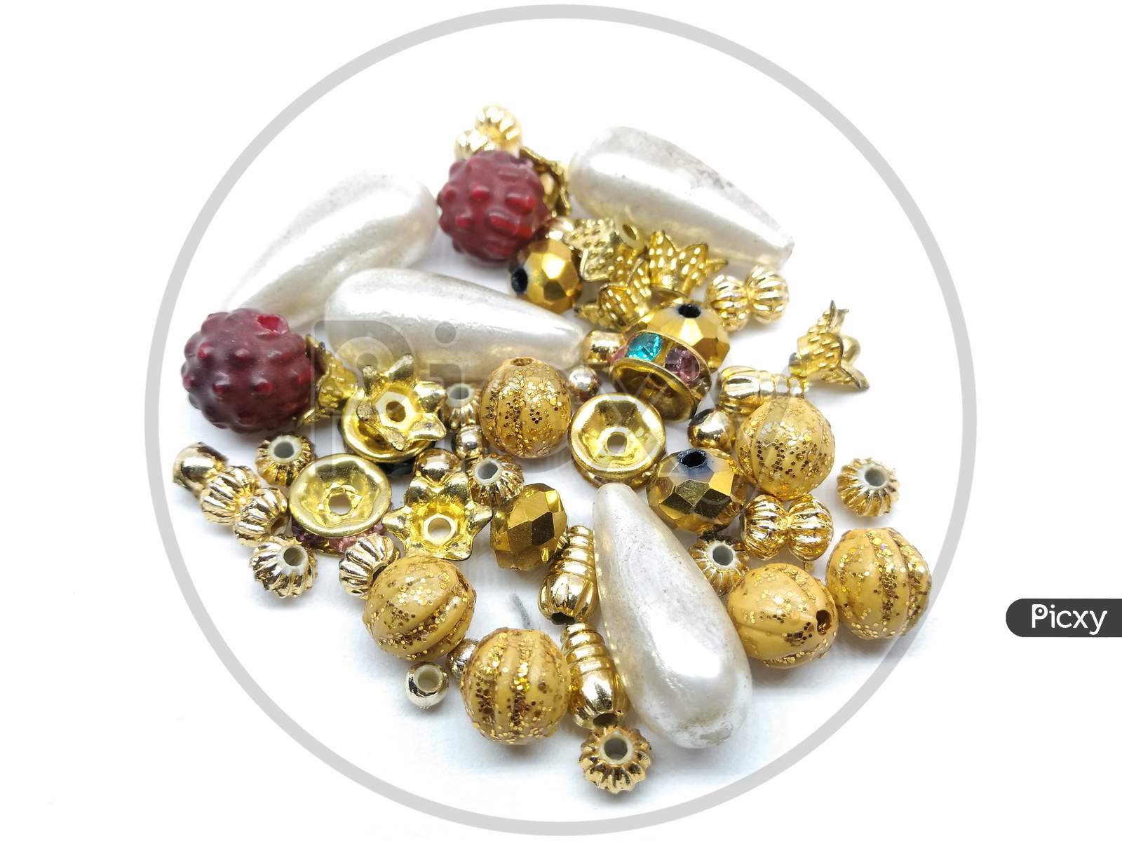 Golden Beads Of an Jewellery On an White Background