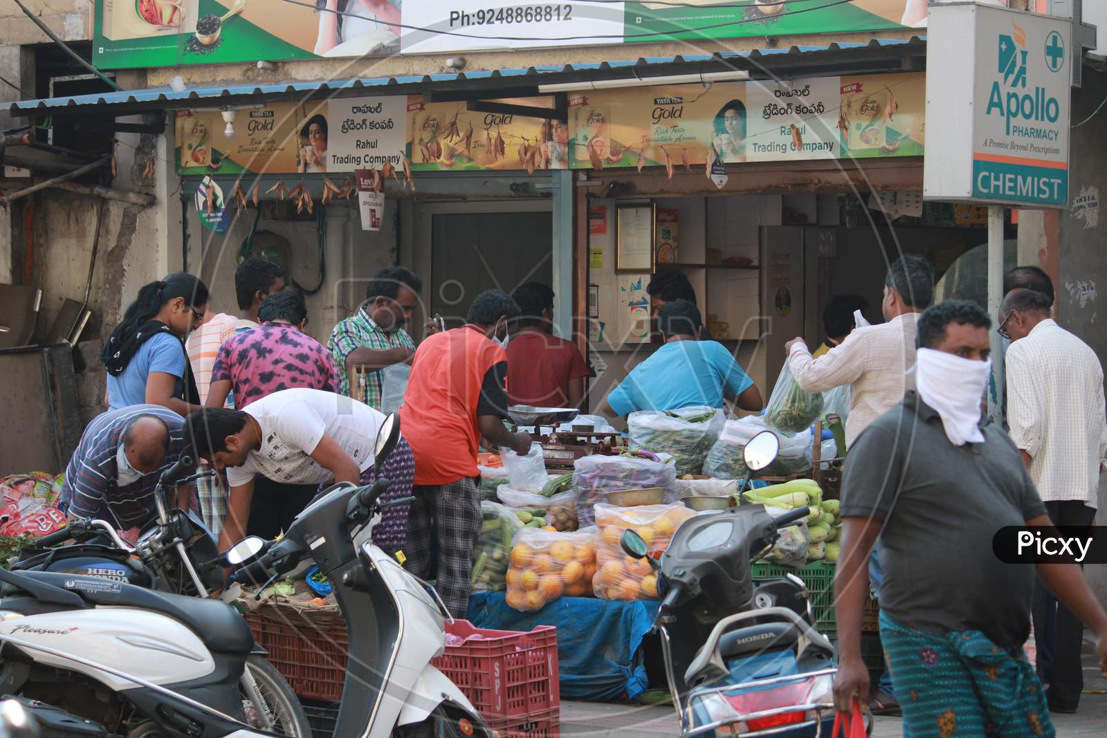 People Wearing Masks At Crowdy Places And At Vegetable And Groceries Stores Amidst Corona Virus Outbreak in India