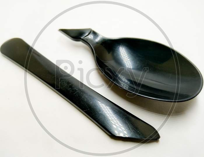 Black Spoon Over an Isolated White Background