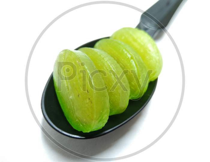Green Mango Candies Or Toffees On White Background