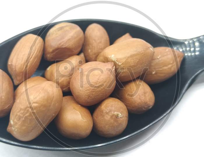 Ground Nuts or Peanuts Closeup On White Background