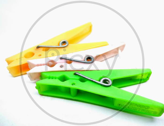 Clothes Drying Clips over an Isolated White  Background