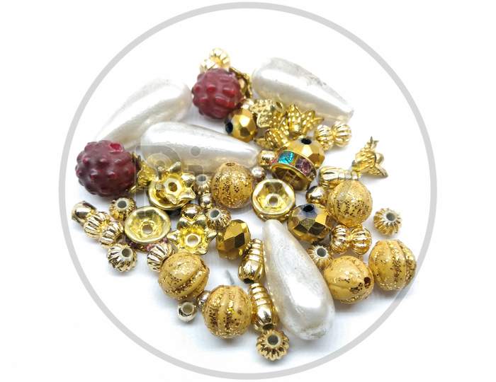 Golden Beads Of an Jewellery On an White Background