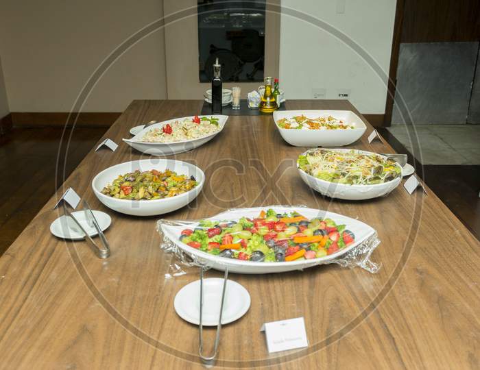 Freshly Made Salad Bowls Served on a Dining Table