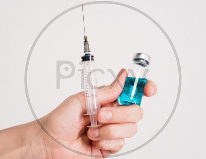 Vial or Medicine With Syringe Over an isolated White Background