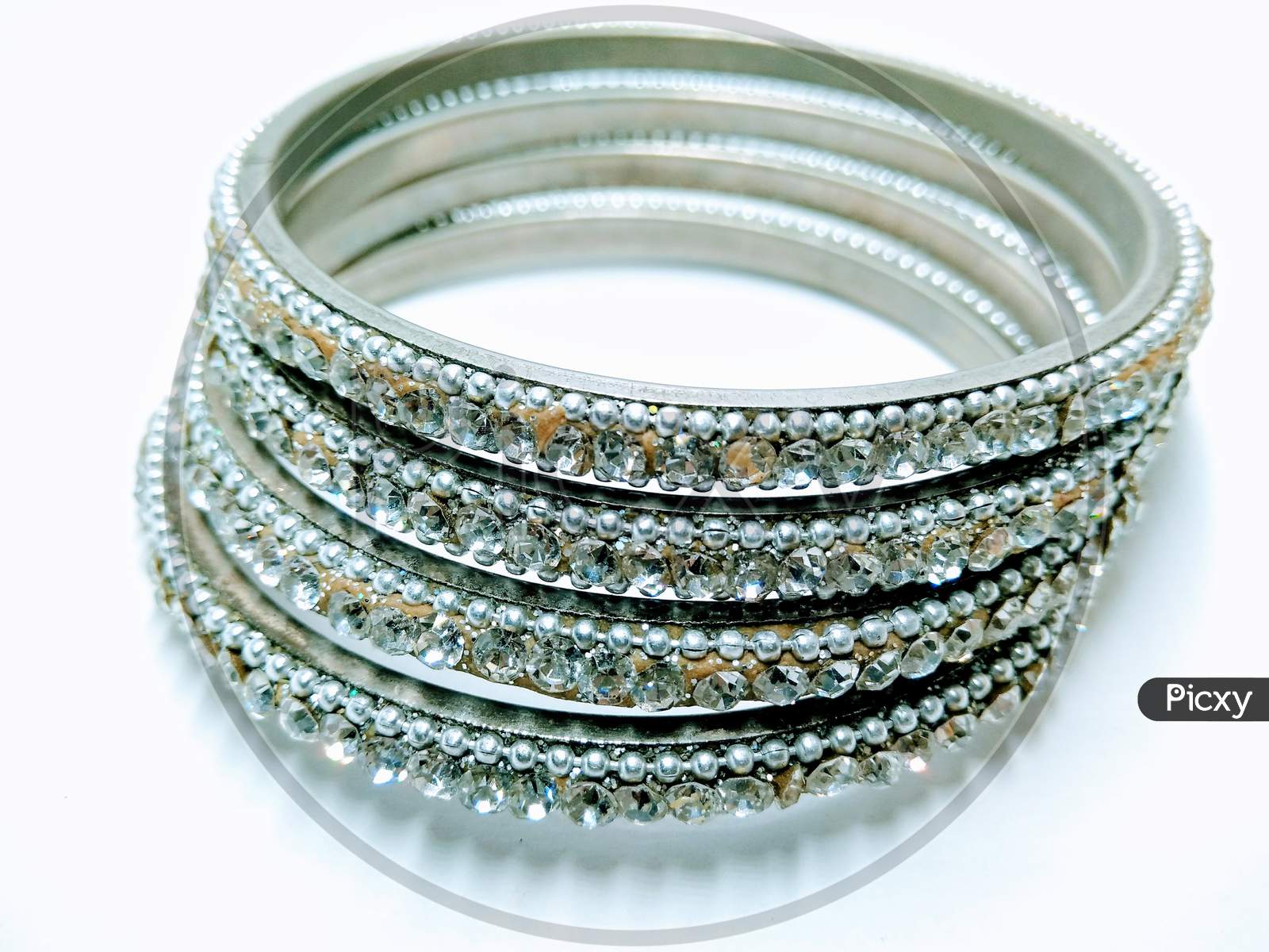 Silver Bangles Over an Isolated White Background