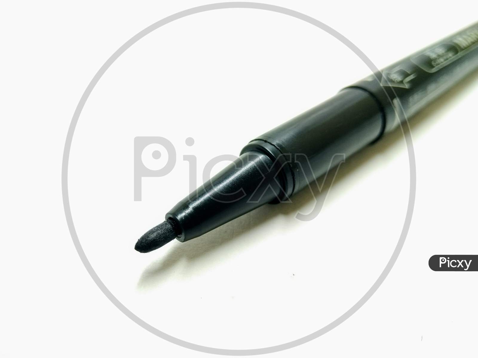 Black Sketch Pen Over an Isolated White  Background