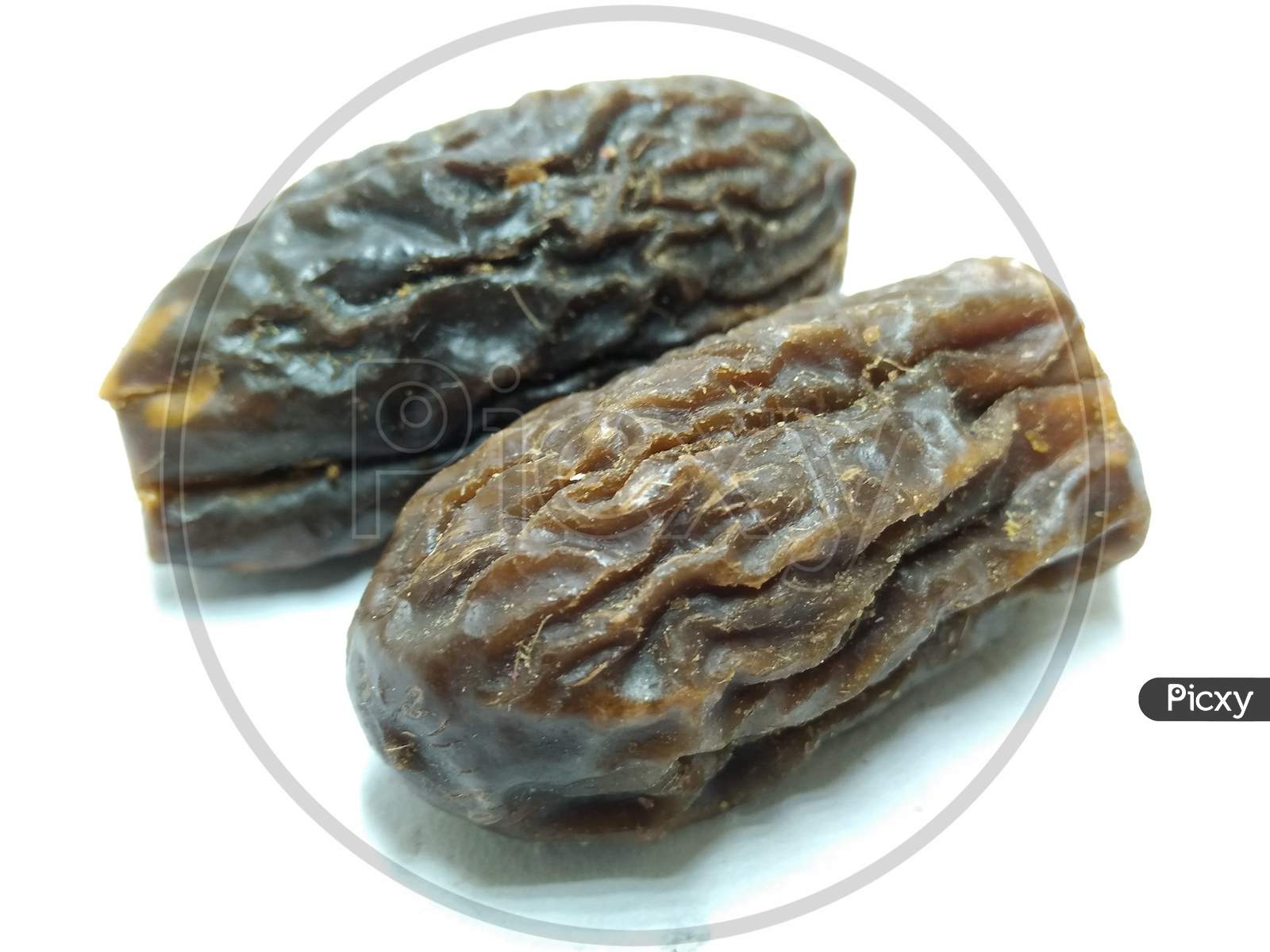 Dried Dates On an White Background