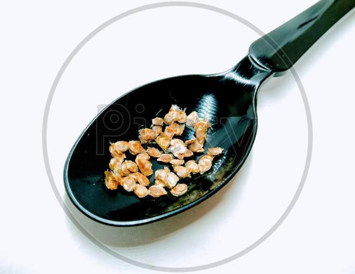 Jowar Flakes Over an Isolated White Background