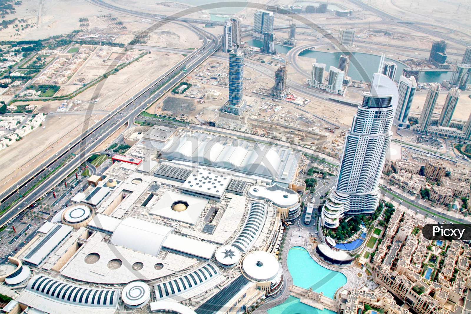 Aerial View Of Downtown Dubai With Dubai Fountain And Skyscrapers From The Tallest Building In The World