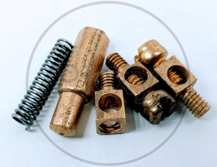 Brass Nuts Or Screws Over an isolated White Background