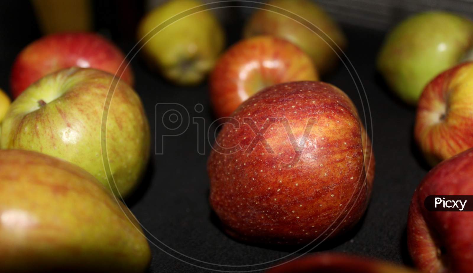 Apples Closeup Shot Over An Isolated Back Background