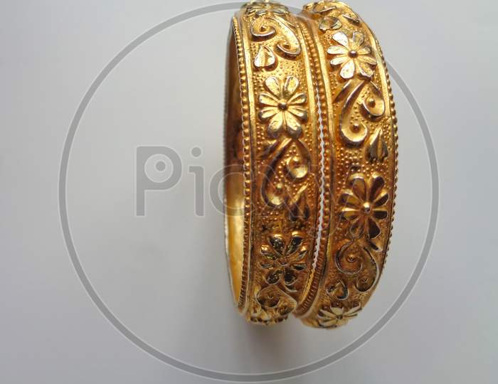 Decorative golden bangle isolated on white background