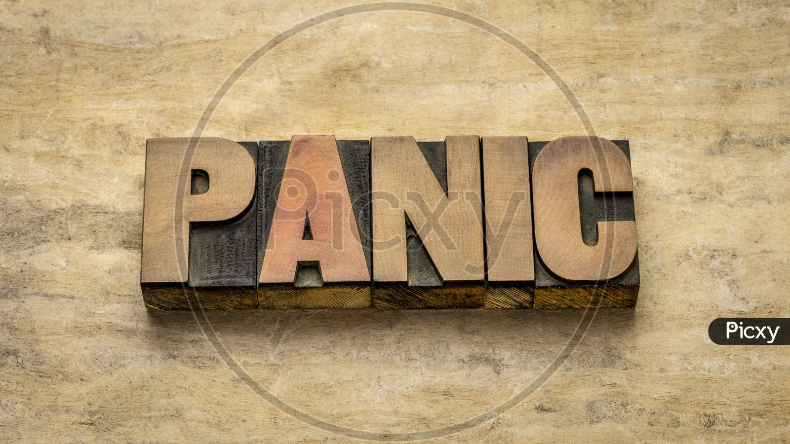 Panic Word Abstract In Vintage Letterpress Wood Type Against Grunge Handmade Paper, Sudden Uncontrollable Fear Or Anxiety