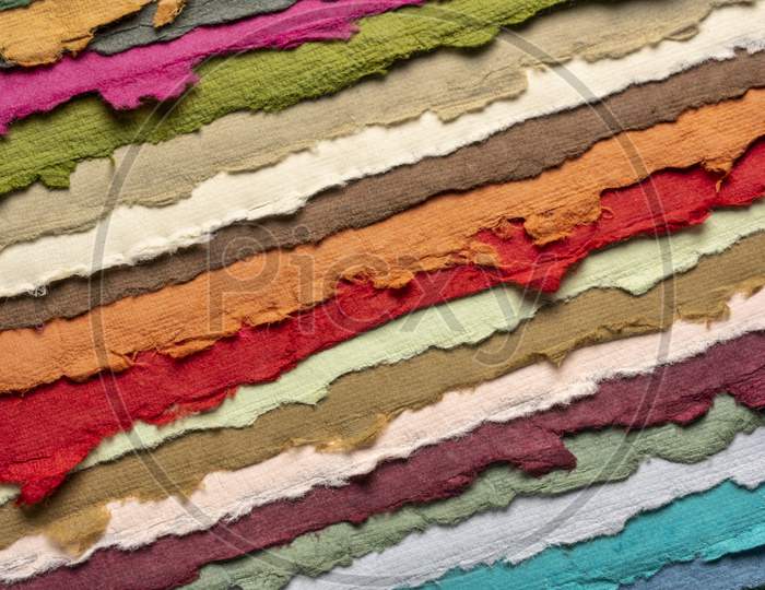 Collection Of Colorful Handmade Indian Paper Sheets With Rough Edges Produced From Recycled Cotton Fabric, Art And Craft Concept