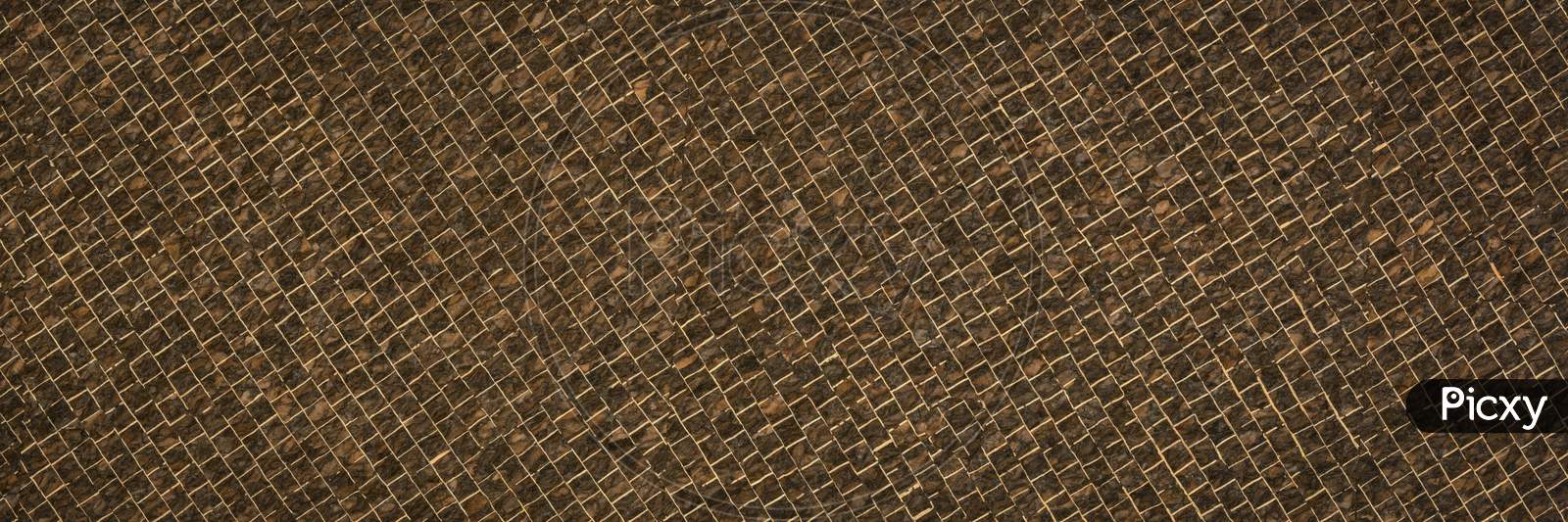 Portuguese Corkskin Paper Background. This Versatile, Naturally Water-Resistant Paper Is Hand Made In Portugal. Thin Layers Of Dark Brown Cork Are Laminated In A Tiny Grid Pattern Onto A Smooth Base Sheet. Panoramic Web Banner.