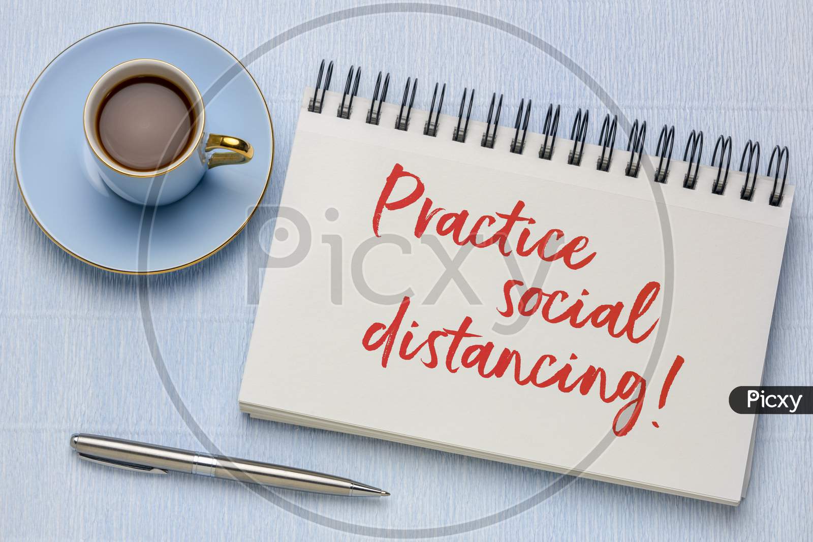 Practice Social Distancing Advice Or Reminder - Handwriting In A Spiral Art Sketchbook With A Cup Of Coffee, Infection Control During Covid-19 Virus Pandemic