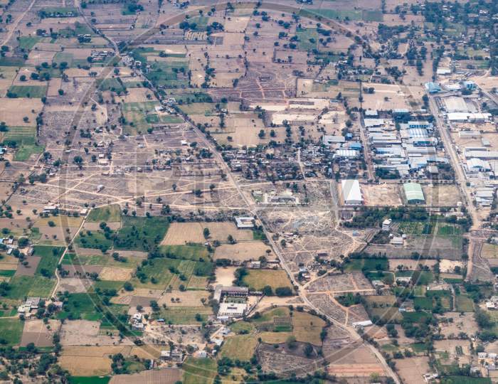 Aerial view of lands farms and green fields from the aeroplane