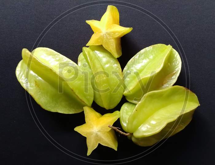 Star fruit in a black background
