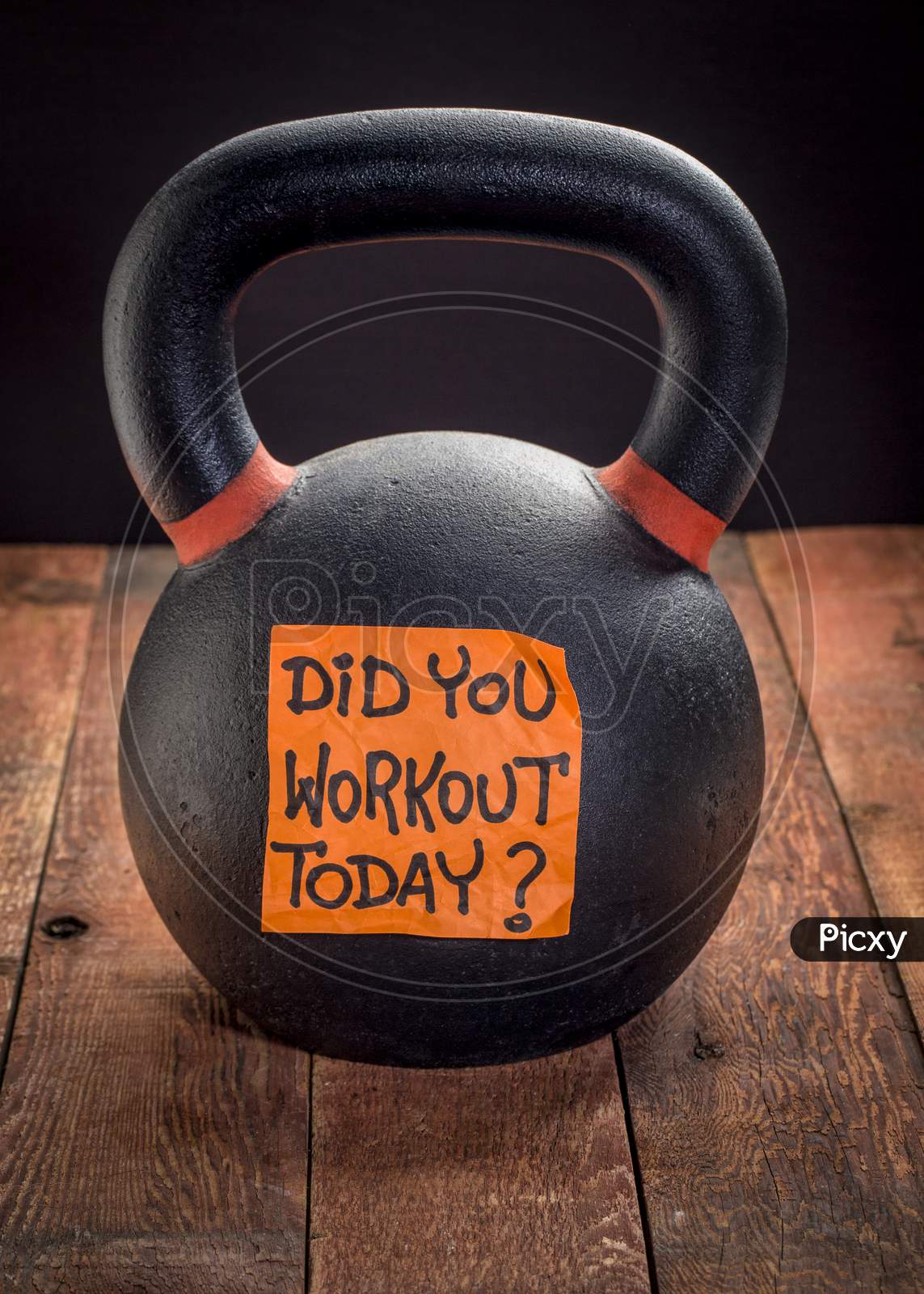 Did You Workout Today?  Reminder Note On A Heavy Iron Kettlebell Against A Rustic Wood Background - Exercise, Weight Training And Fitness Concept