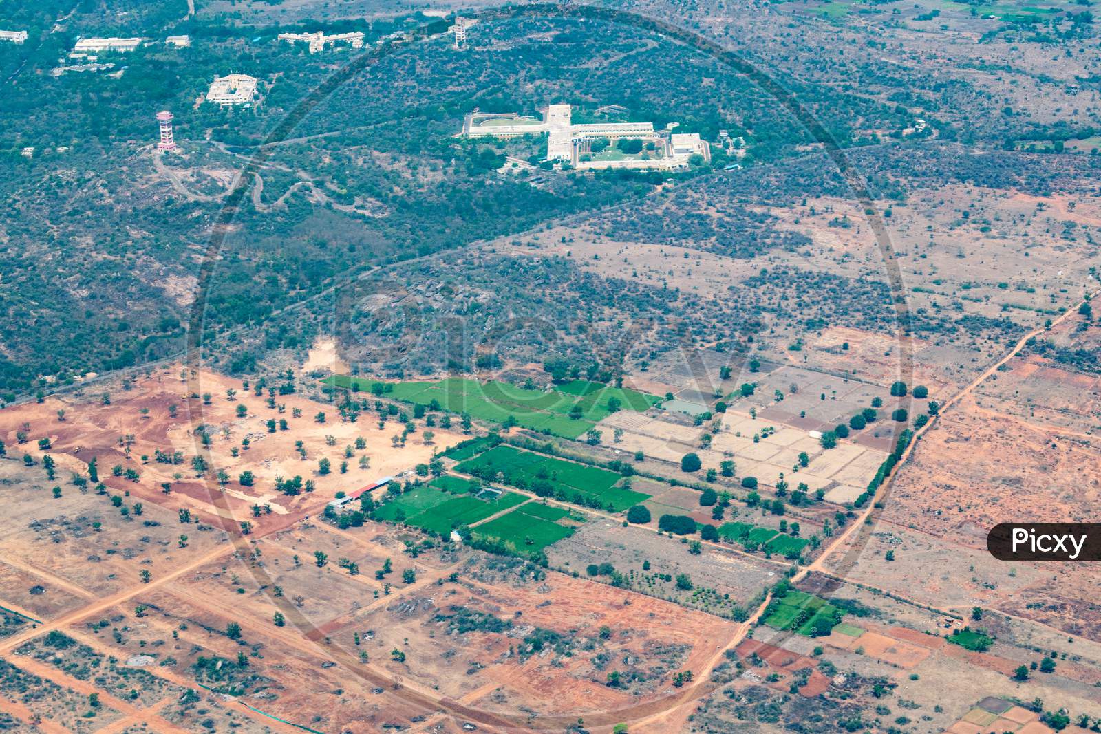 Aerial view of lands farms and green fields from the aeroplane