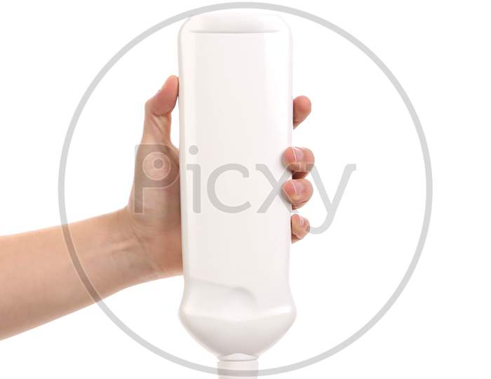 Hand Holding White Plastic Bottle. Isolated On A White Background.