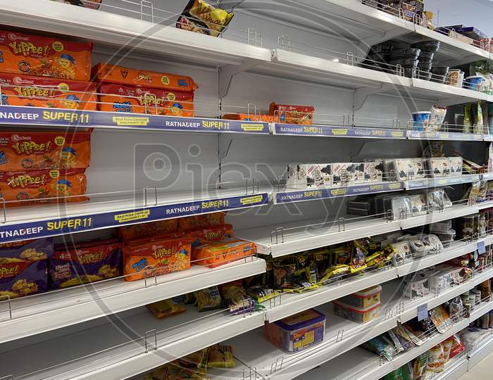 Empty Shelves In Super Markets  As  People Shopping Wearing Masks Amidst Corona Virus Or COVID 19  Outbreak in India