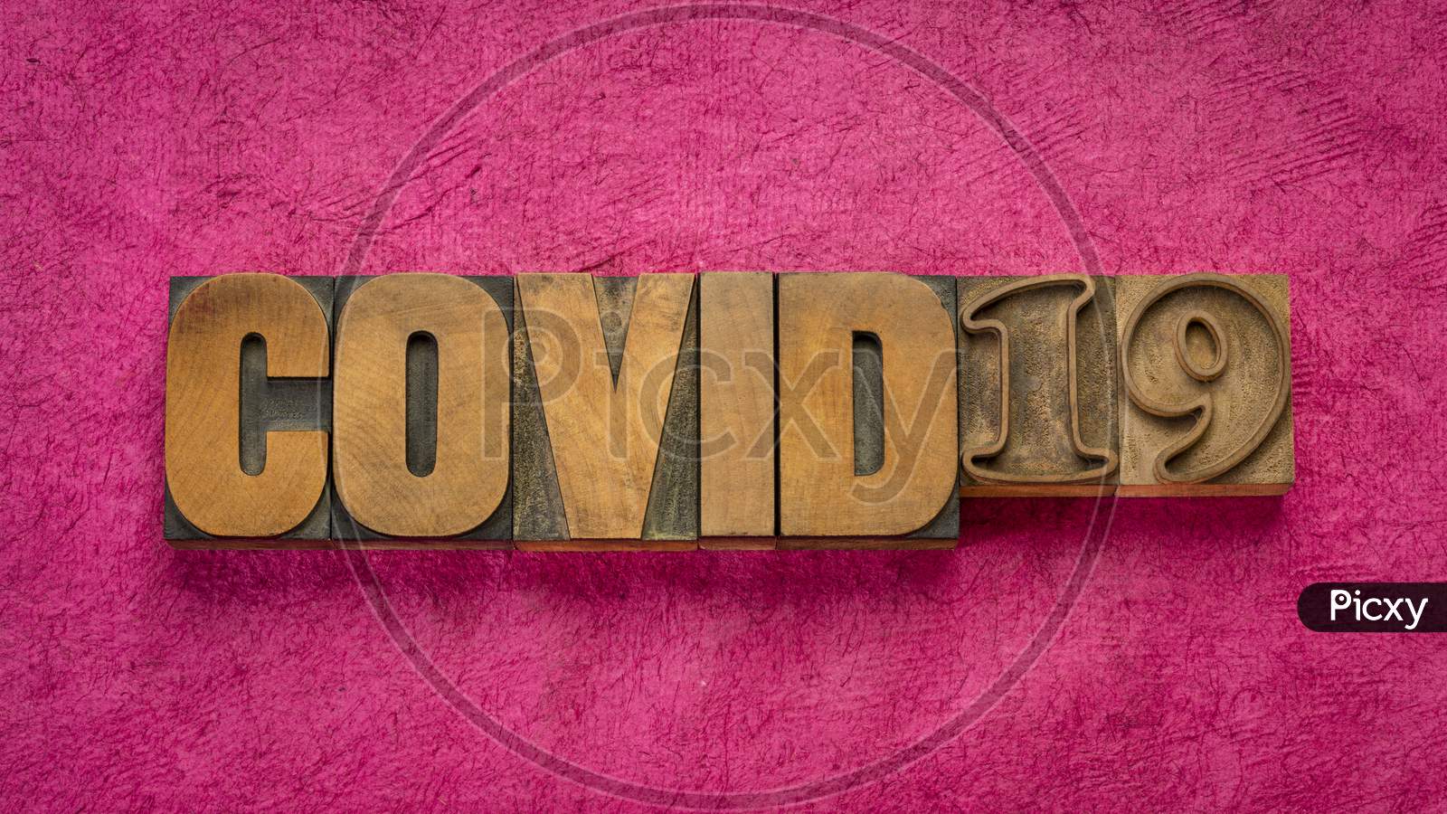 Covid-19 Word Abstract In Vintage Letterpress Wood Type Against Handmade Bark Paper, , Coronavirus Outbreak And Pandemic Concept