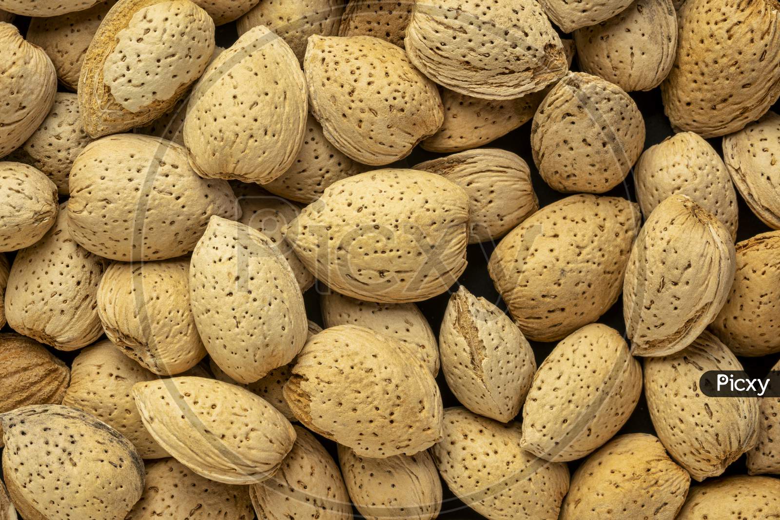Almond Nuts In Shells - Closeup Background, Superfood Concept