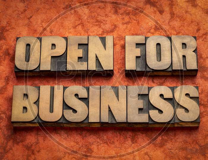 Open For Business Word Abstract In Vintage Letterpress Wood Type, Business Operation During Coronavirus Pandemic Concept