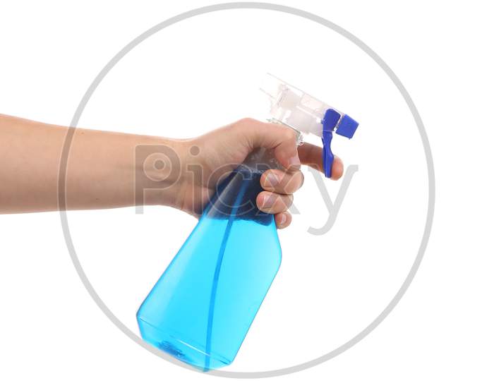 Hand Holding Blue Plastic Spray Bottle. Isolated On A White Background.