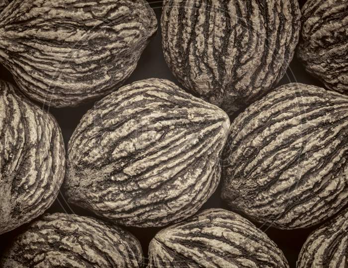 Abstract Background Of Organic Black Walnuts In Shells, Black And White Platinum Toned Image