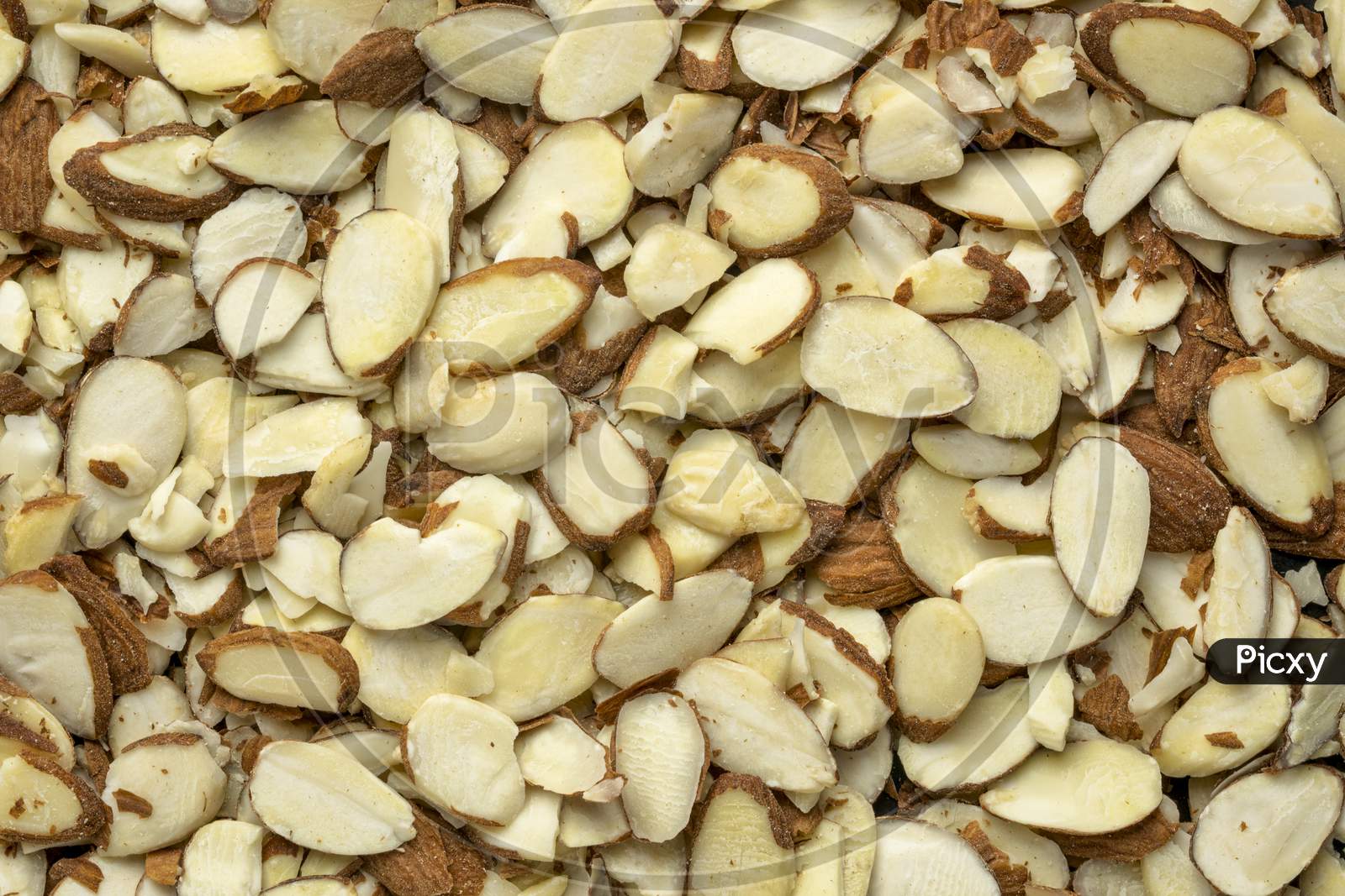 Raw Sliced Almond Nuts - Closeup Background