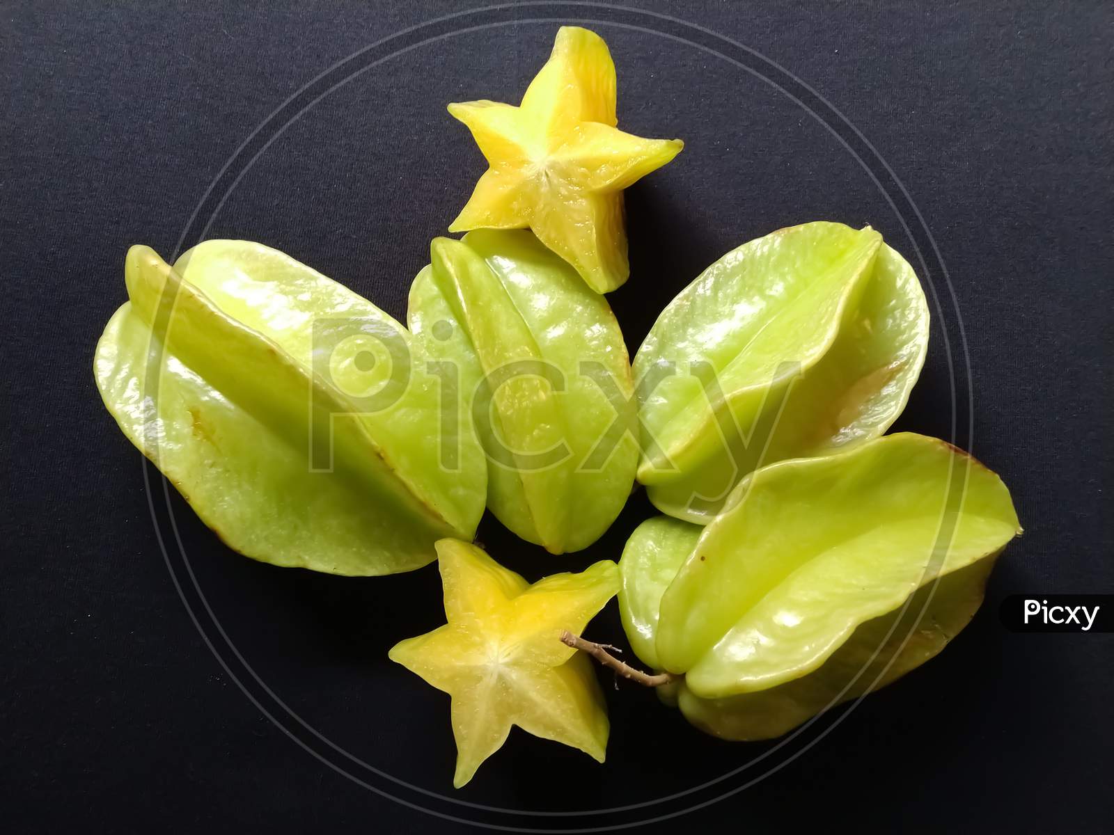 Star fruit in a black background
