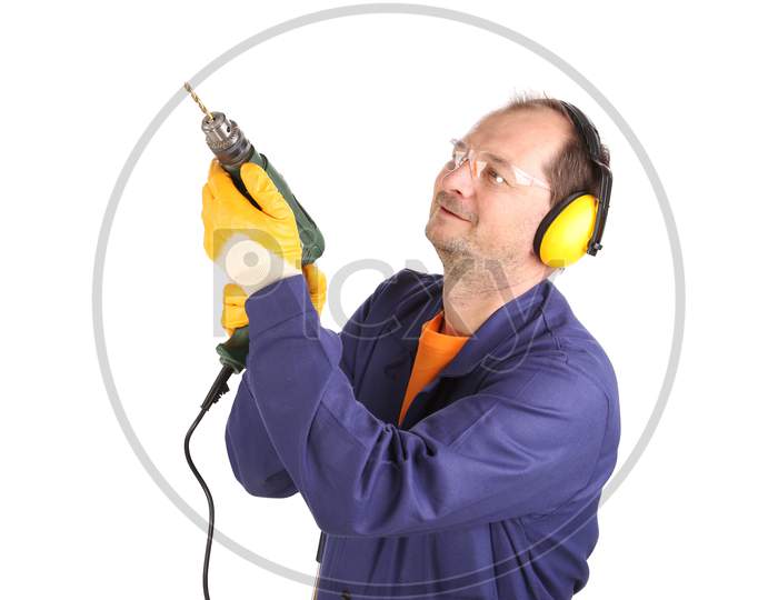 Worker In Ear Muffs And Glasses With Drill. Isolated On A White Backgropund.