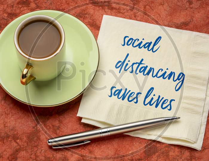 Social Distancing Saves Lives Reminder - Handwriting On A Napkin, Coronavirus Pandemic Recommedation