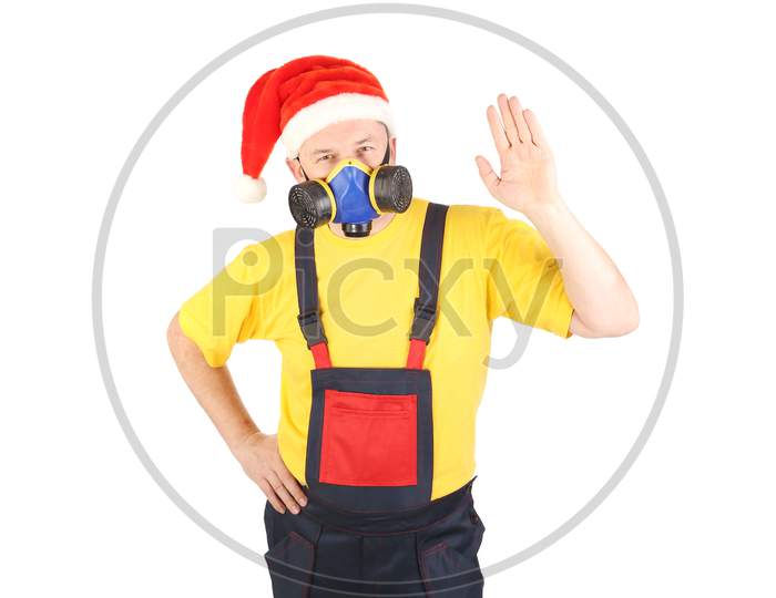 Worker In Gas Mask And Santa Hat Say Hi. Isolated On A White Background.