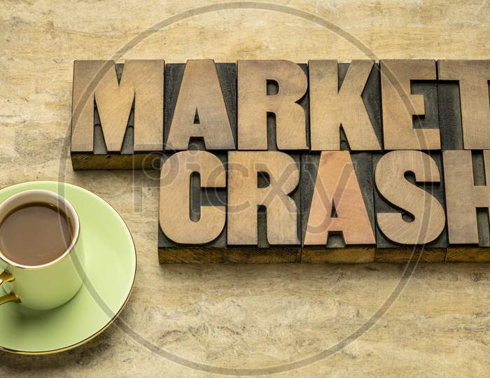 Market Crash Word Abstract In Vintage Letterpress Wood Type With Coffee, Business And Finance Concept