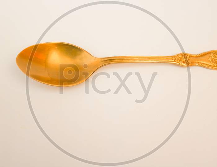 Copper spoon isolated on white background
