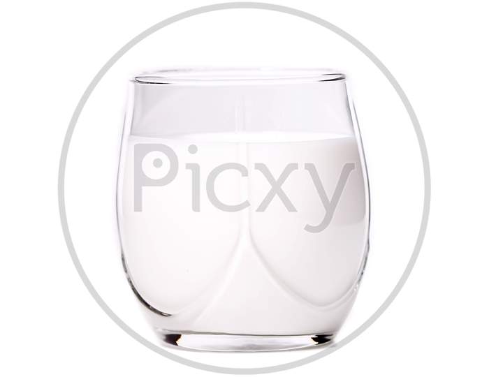 Close Up Of Glass Of Milk. Isolated On A White Background.