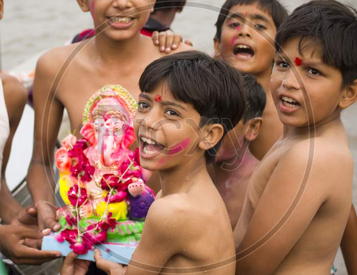 Kids Excited On Ganesh Visarjan Festival, Ahmedabad,Sabarmati Riverfront,2014,Gujarat.India