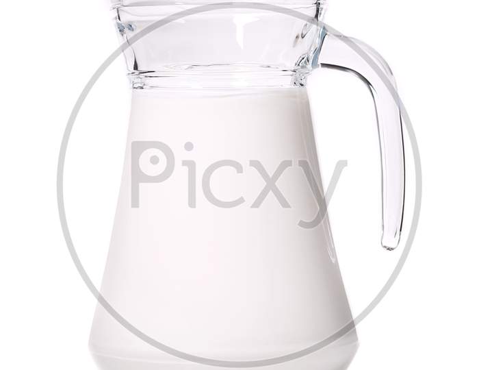 Close Up Of Glass Carafe With Milk. Isolated On White Background.