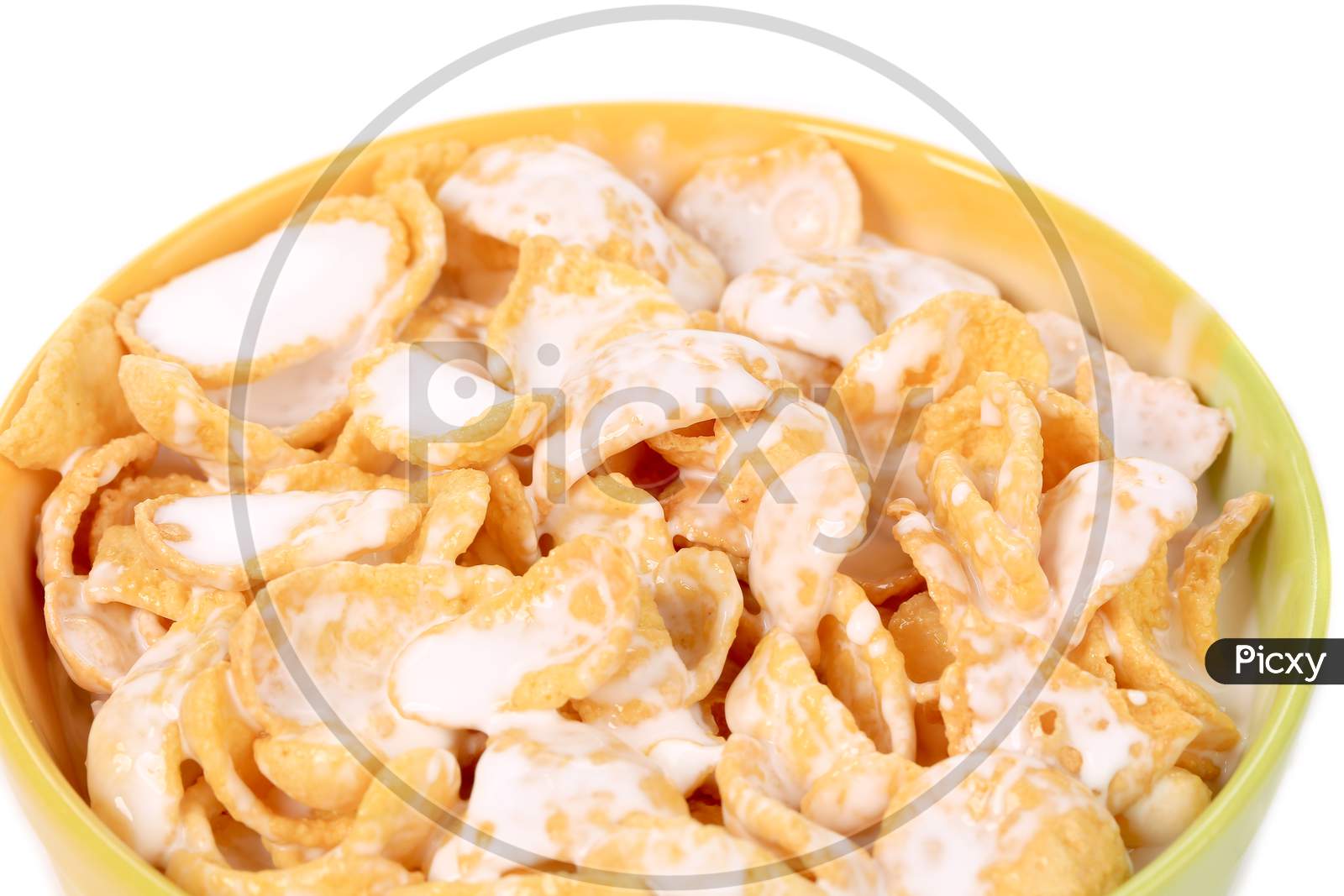 Close Up Of Corn Flakes With Milk. Whole Background.